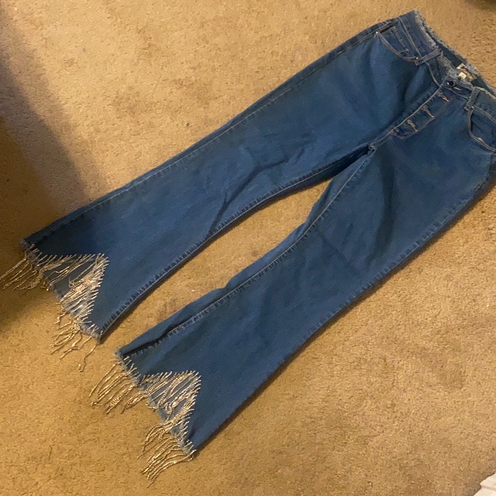 Flare leg jeans with sparkle fringes
